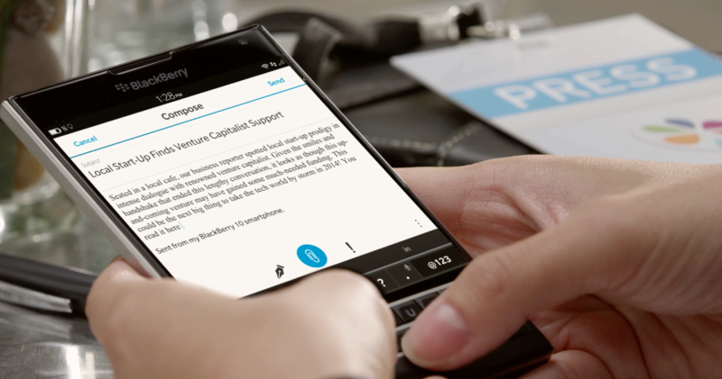Image of someone typing on a BlackBerry Passport