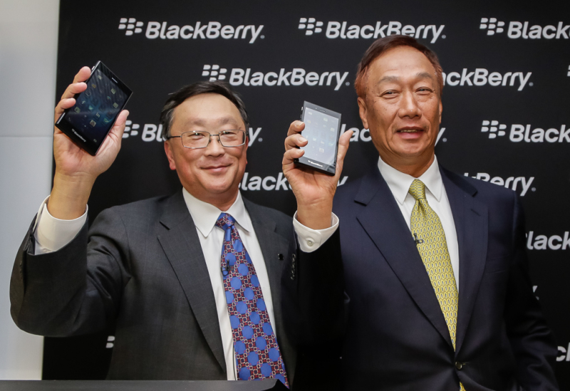 John Chen, Executive Chairman and CEO at BlackBerry & Terry Gou, Founder and Chairman, Foxconn holding the new BlackBerry Z3 at Mobile World Congress, 2014.