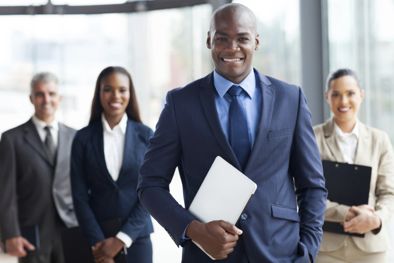 african businessman with group of businesspeople