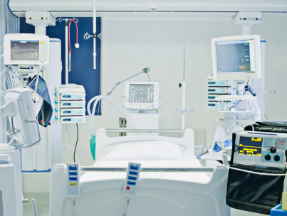 Empty hospital bed in intensive care