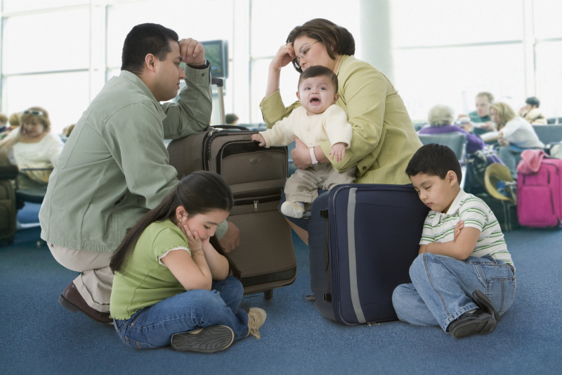Multi-ethnic family waiting in airport