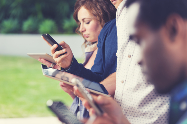 Group of people using mobile devices