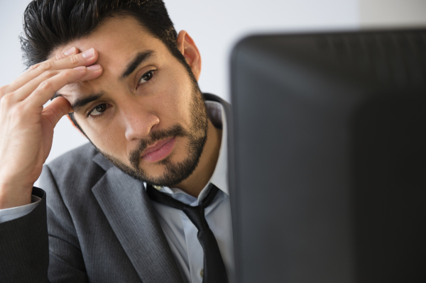 Mixed race businessman working in office