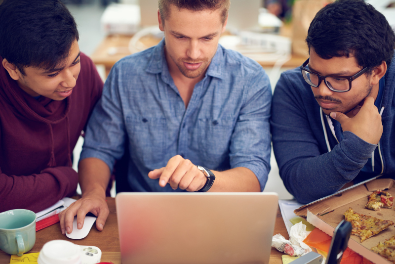 Shot of young designers working around a laptop in an office