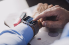 Businessman using smartwatch.